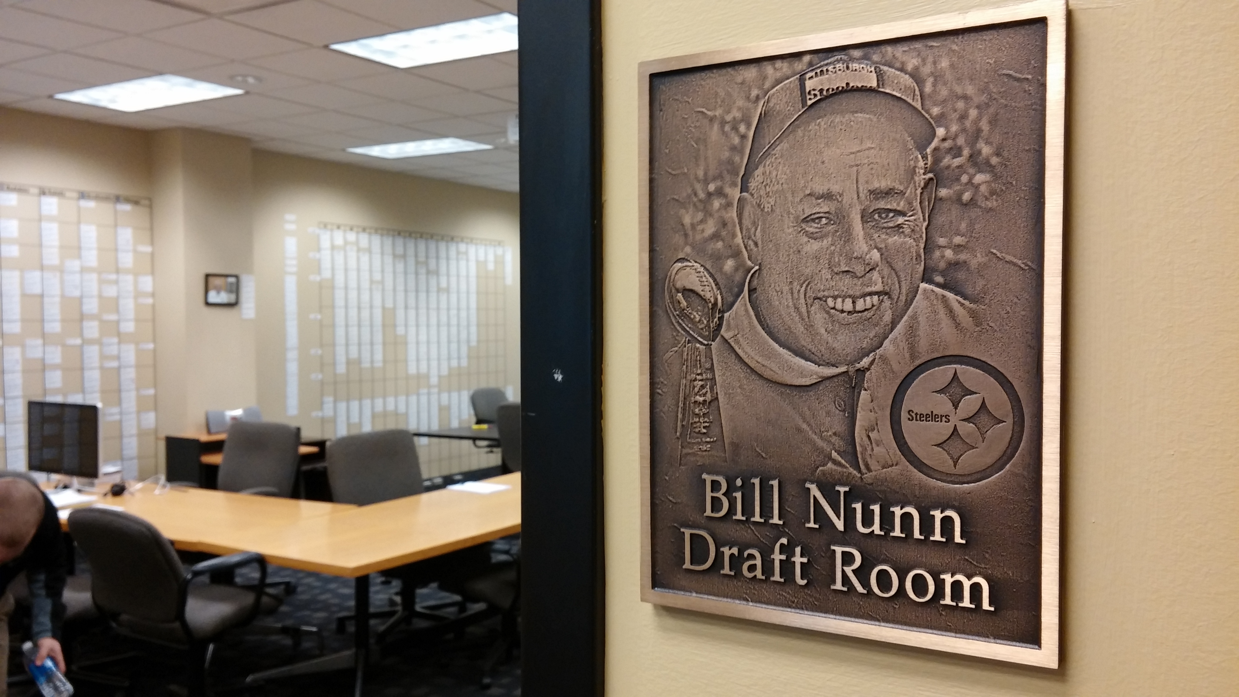 Nunn plaque: Steelers scout Bill Nunn Jr. helped the team find many of its late-round draft picks during the 1970s. A plaque with his name and face now hangs outside the draft room door. Photo courtesy of Andrew Conte